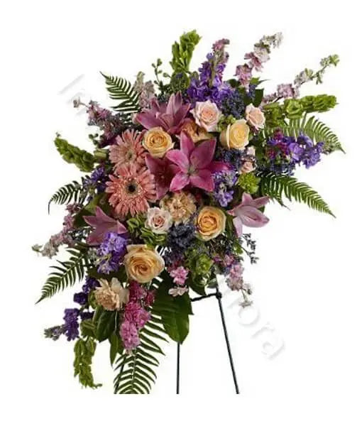 Composizione funebre di fiori dai colori decisi Fiori a Domicilio