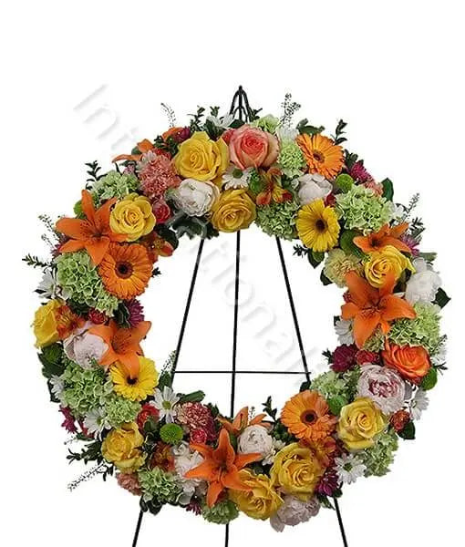 Corona funebre dai toni rosa e arancio Fiori a Domicilio