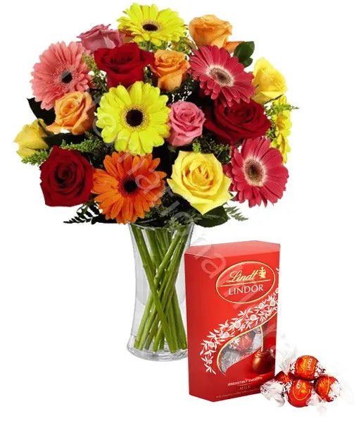 Bouquet di Rose e Gerbere colorate con scatola di Lindor Fiori a Domicilio